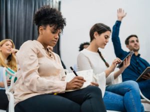 group-young-people-sitting-conference-together-while-raising-their-hands-ask-question-business-team-meeting-seminar-training-concept_58466-12403(1)